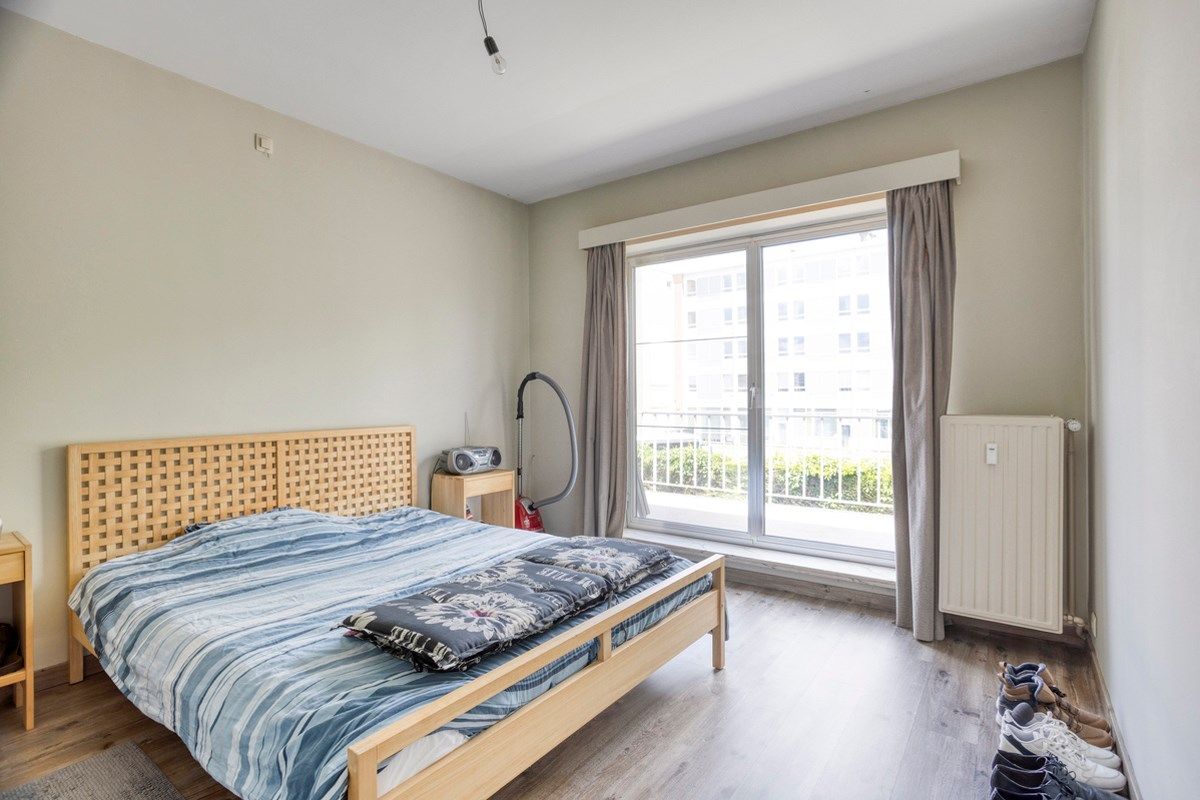 Opbrengsteigendom met 3 appartementen, garages en tuin foto 16