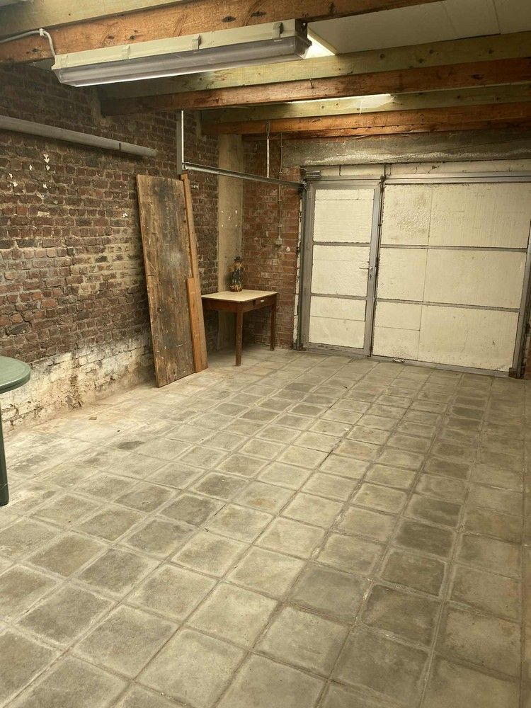 Te renoveren rijwoning met tuin en garage – centraal gelegen met veel potentieel! foto 7