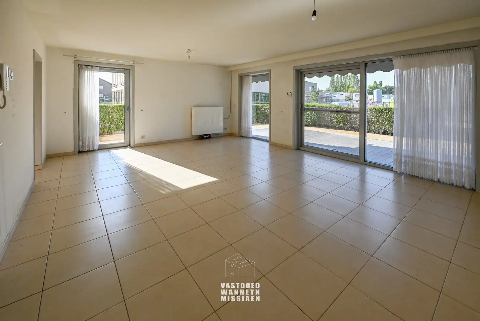 Ruim gelijkvloers appartement met 2 slpk en zonnige tuin/terras foto 2