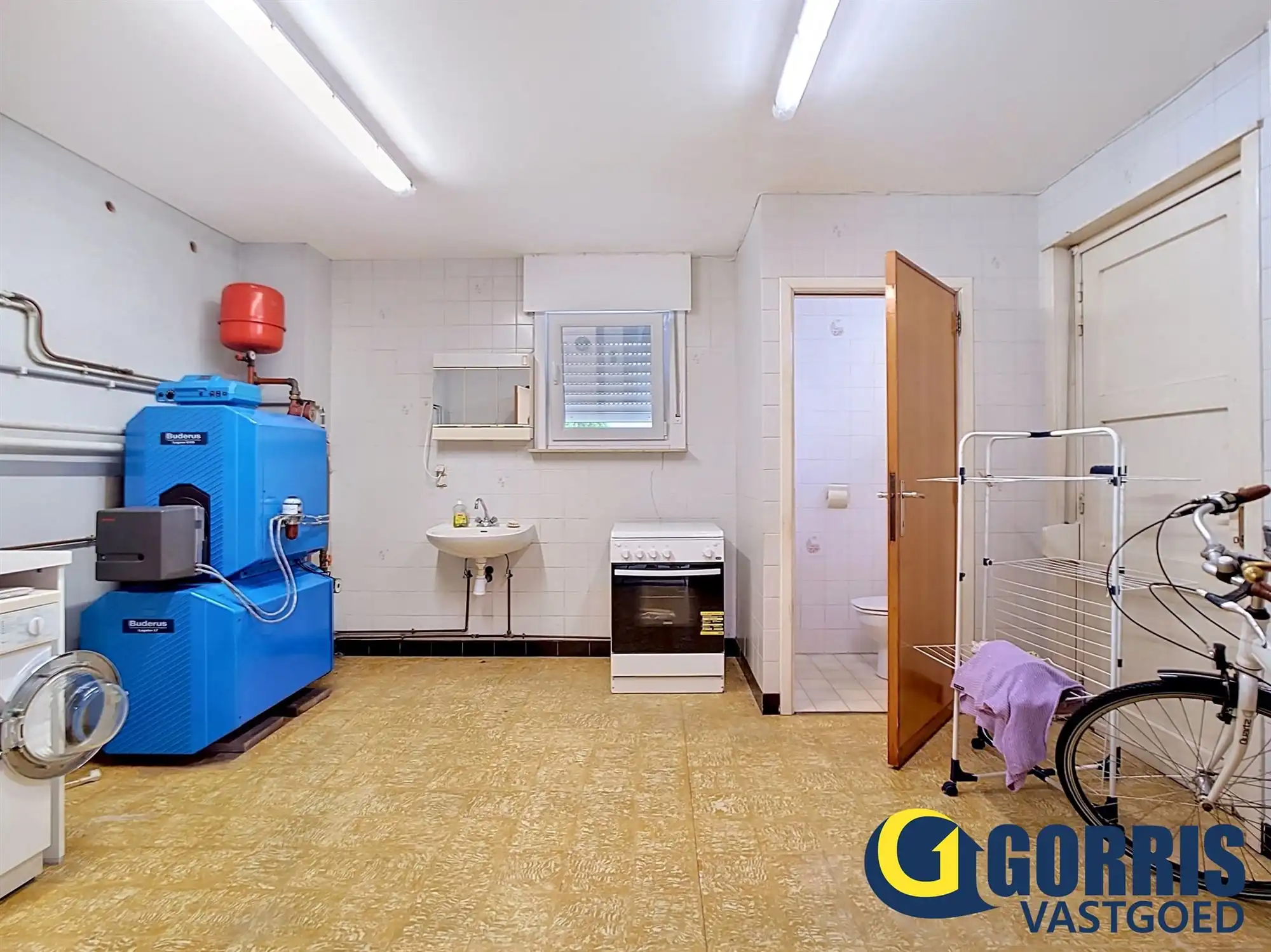 Te renoveren woning met ruime tuin in het centrum van Hulshout foto 3