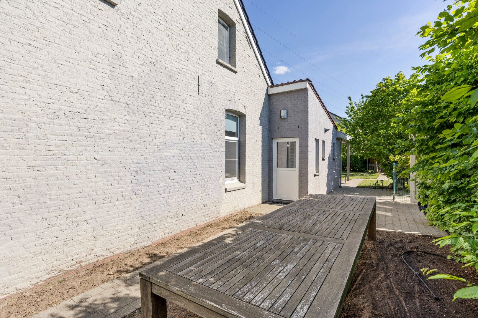 Instapklare woning met 3 SLPKS en zon georiënteerde tuin !  foto 32