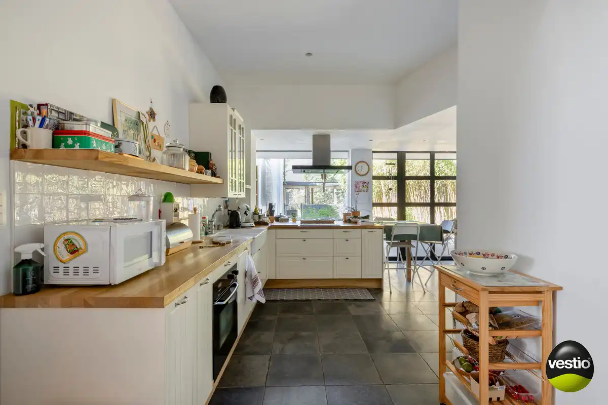 OPBRENGSTEIGENDOM VAN BUREEL, WONING, MAGAZIJN EN 2 APPARTEMENTEN TONGEREN LANGS N79. foto 9