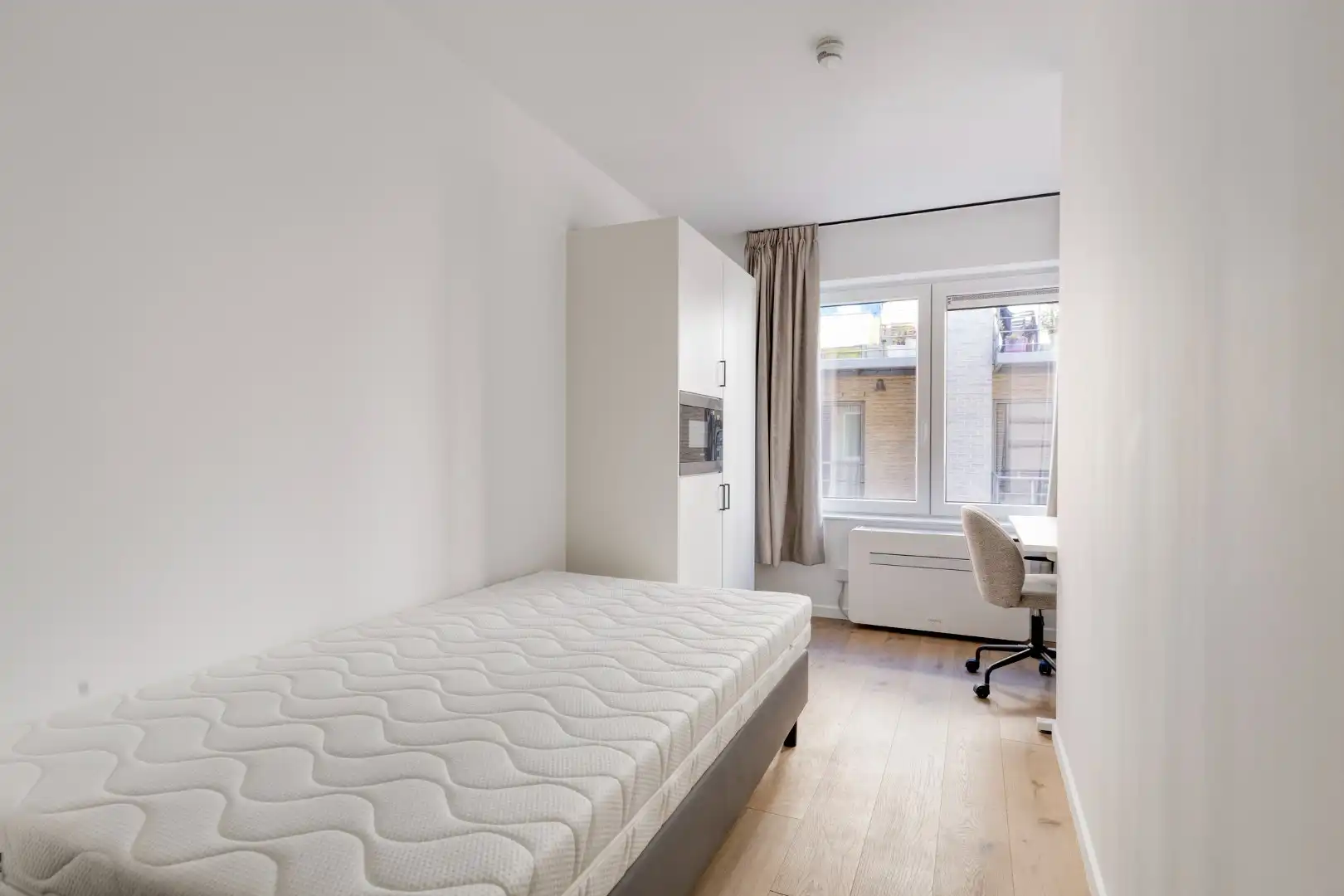 Volledig gerenoveerde studentenkamer in residentie met 15 studentenkamers en een 1slaapkamer appartement in hartje Leuven - EPC label A! foto 5