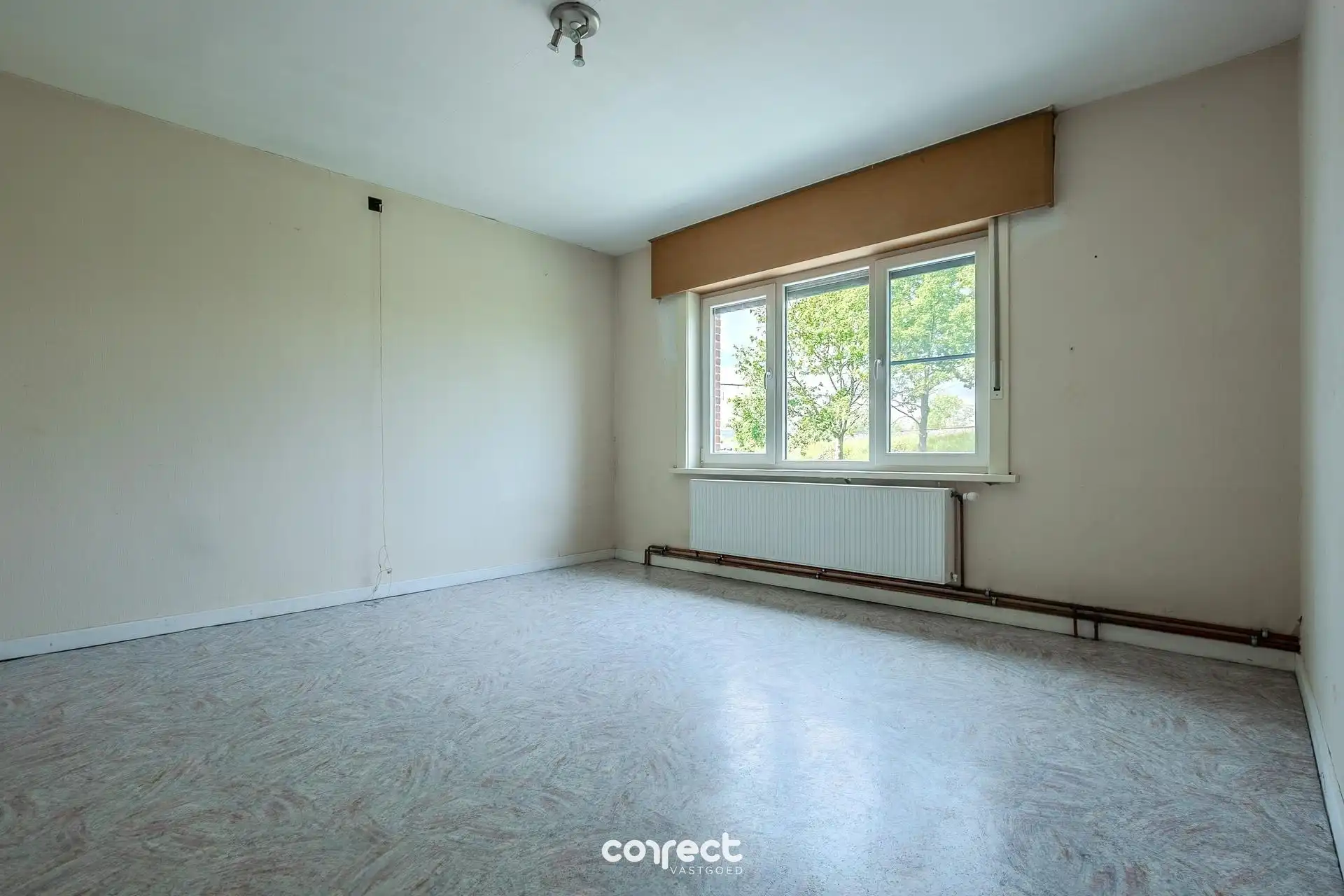 Verzorgde woning met 3 slpkrs, garage en tuin foto 10