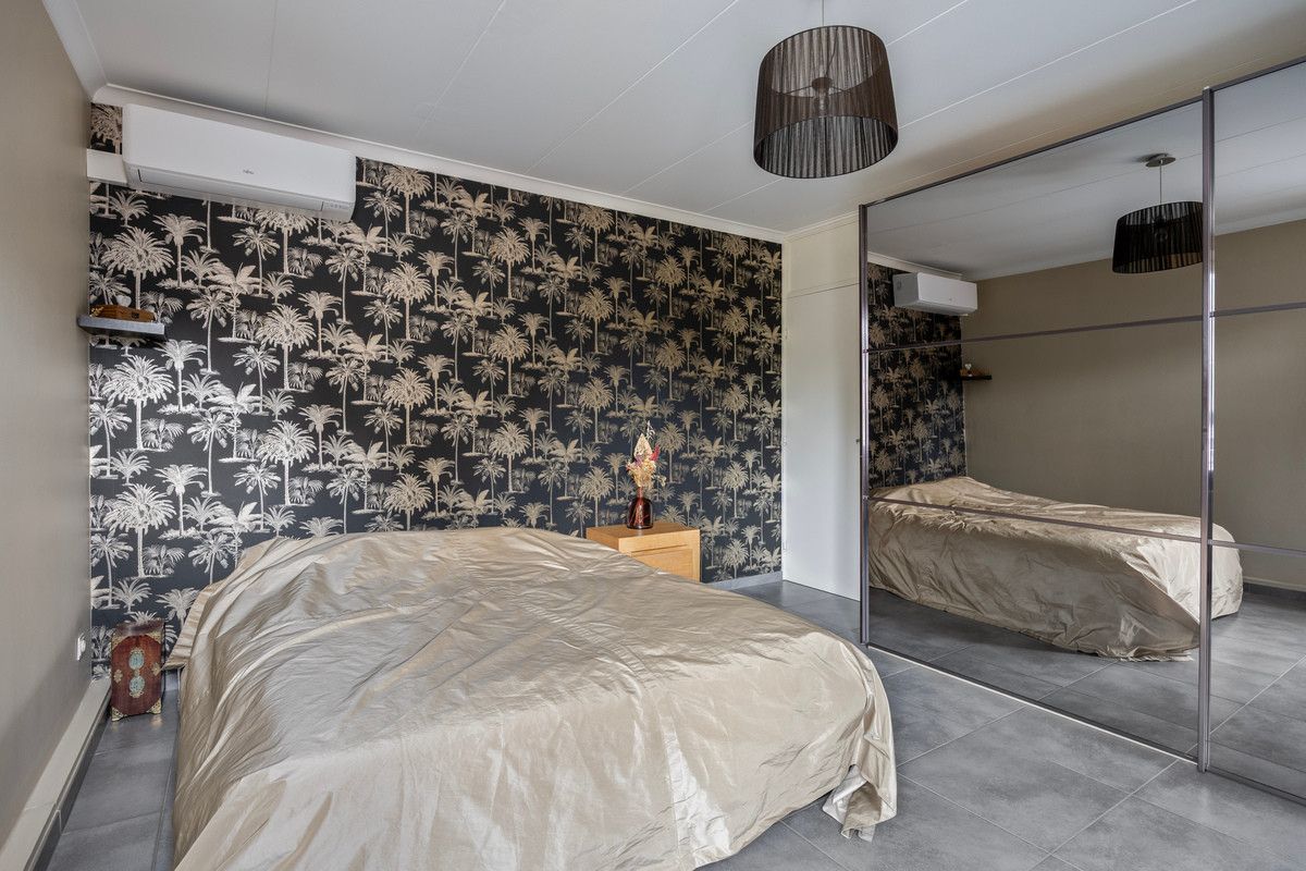 TIJDLOZE PAREL IN HET GROEN - STIJLVOL GERENOVEERDE VRIJSTAANDE WONING MET PRAKTIJK- OF BUREAURUIMTE OP RUIM PERCEEL VAN 13A31CA. foto 24