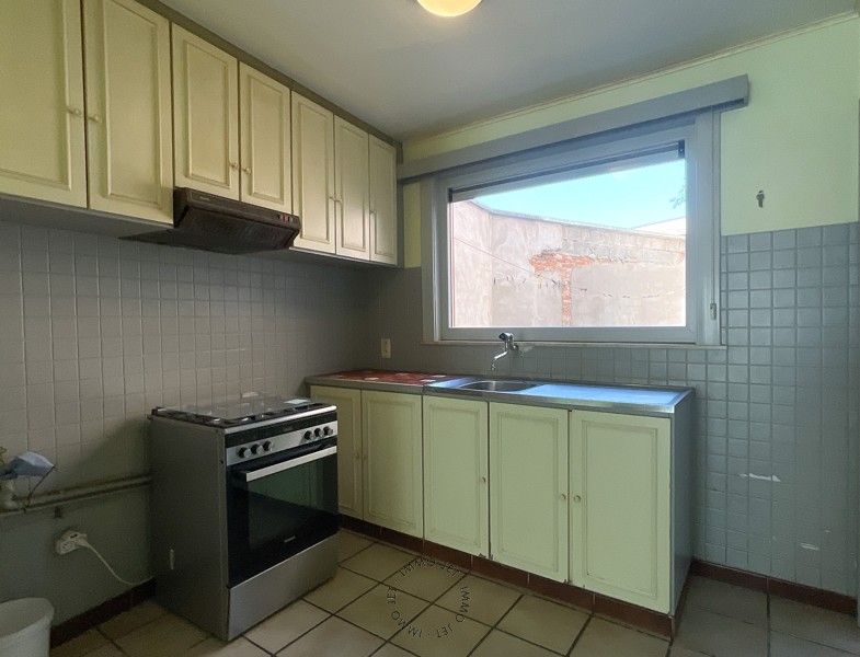 Woning met 2 slaapkamers en koer in het centrum van Sint-Gillis-Waas foto 4