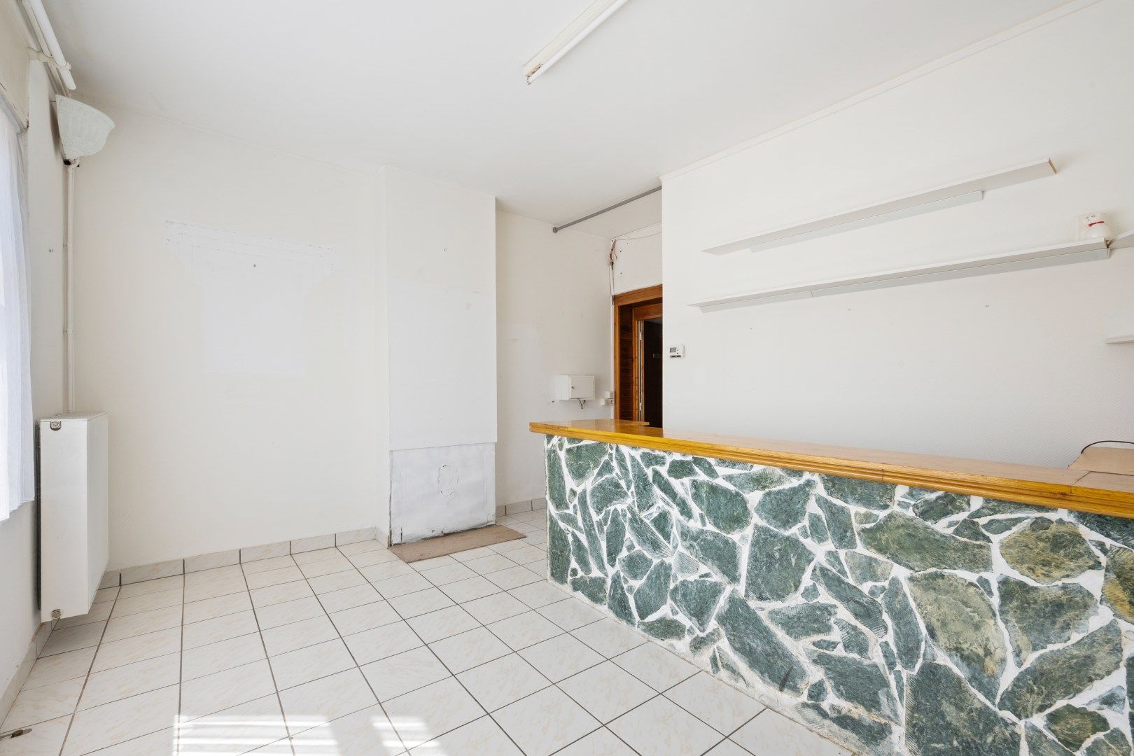Te renoveren hoekwoning op strategische ligging foto 5