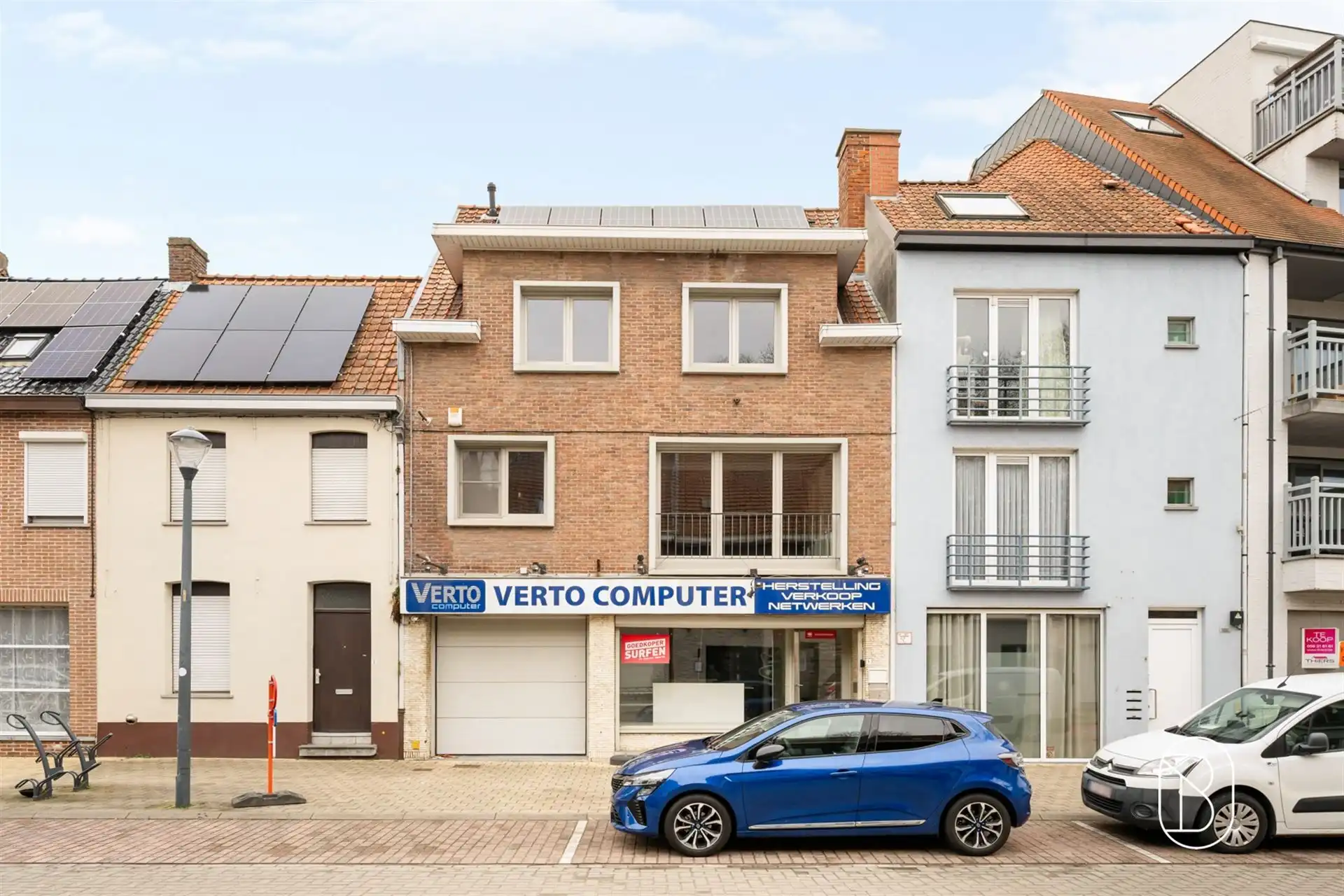 Handelspand met ruime woonst, garage en leuk terras foto 2