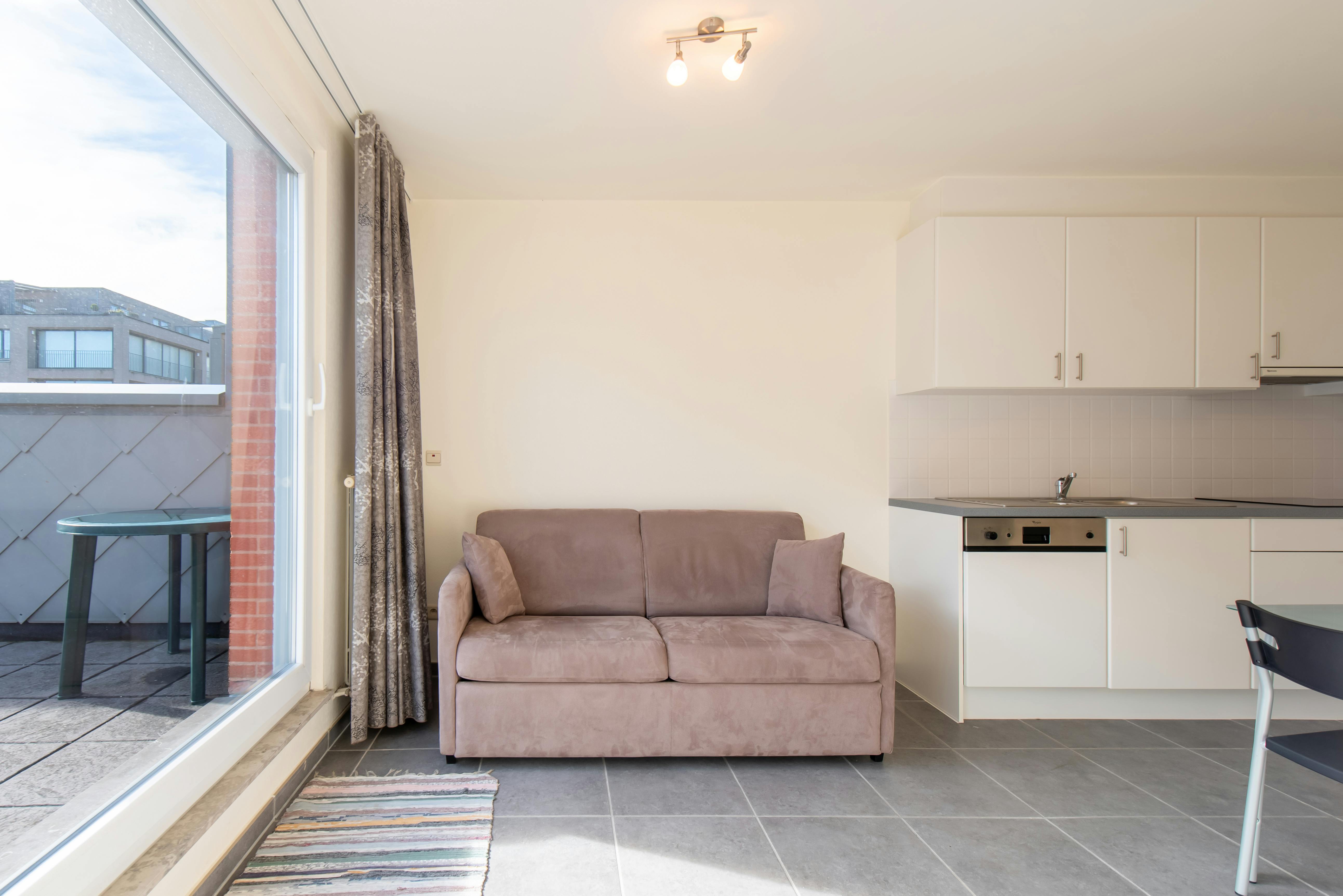 Zuidgerichte penthouse studio met ruime terrassen op topligging! foto 3