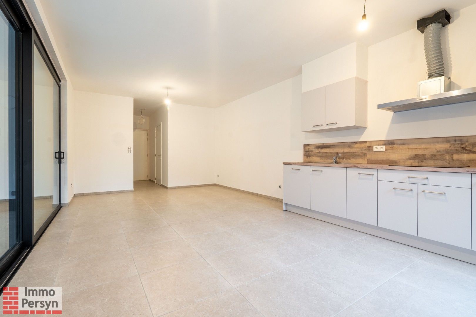 Gelijkvloers nieuwbouwappartement met terras en tuintje foto 3