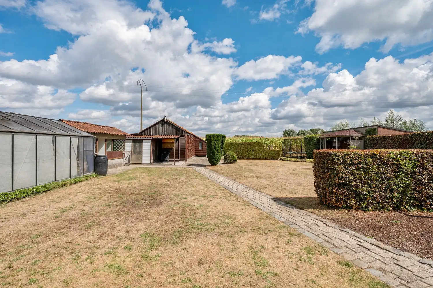 Instapklare open bebouwing op een ruim perceel van 1.185 m², landelijk gelegen met een prachtig vrij uitzicht aan de achterzijde. foto 35