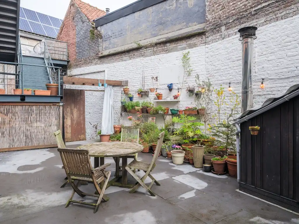 Bijzonder ruime duplex loft (263 m2&nbsp;bvo) met buitenruimte, 3 slaapkamers, 2 badkamers en inpandige garage nabij de Vrijdagsmarkt. foto 11