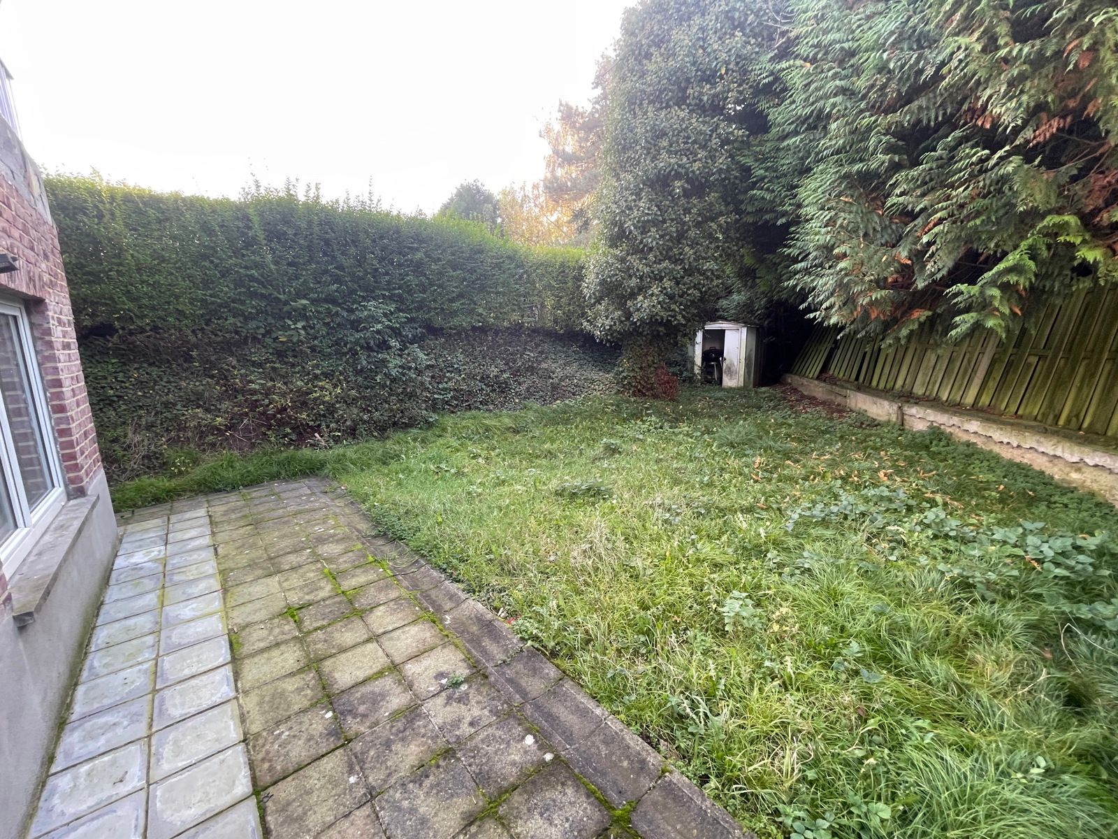 Opbrengsteigendom met 3 appartementen en tuin foto 4