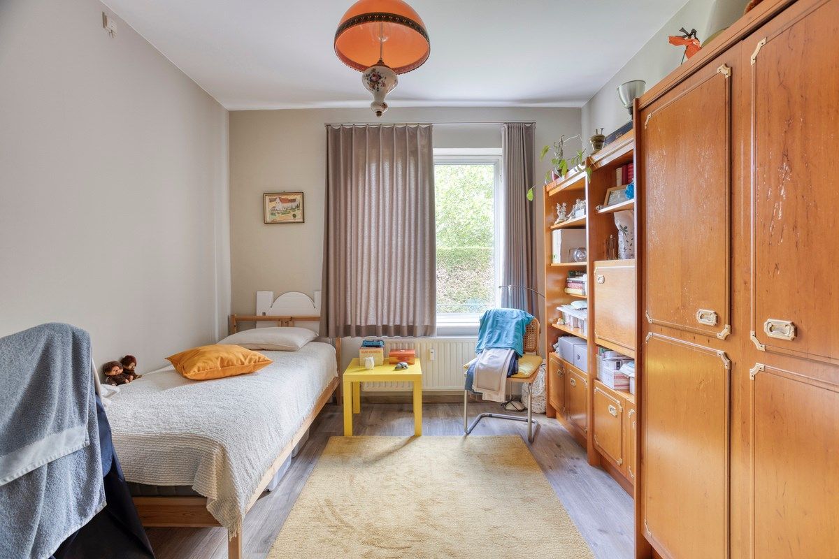 Opbrengsteigendom met 3 appartementen, garages en tuin foto 10