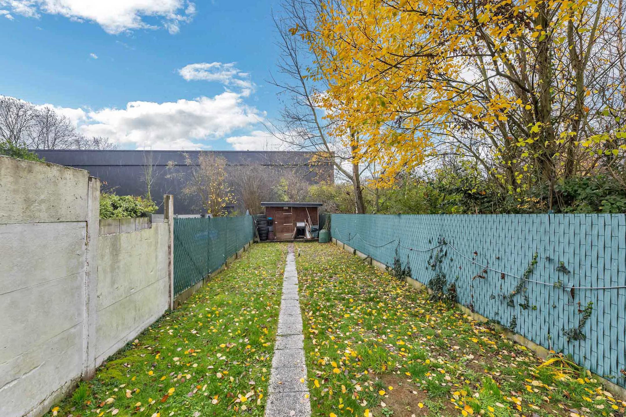 Gesloten bebouwing met 4 slaapkamers en tuin foto 16