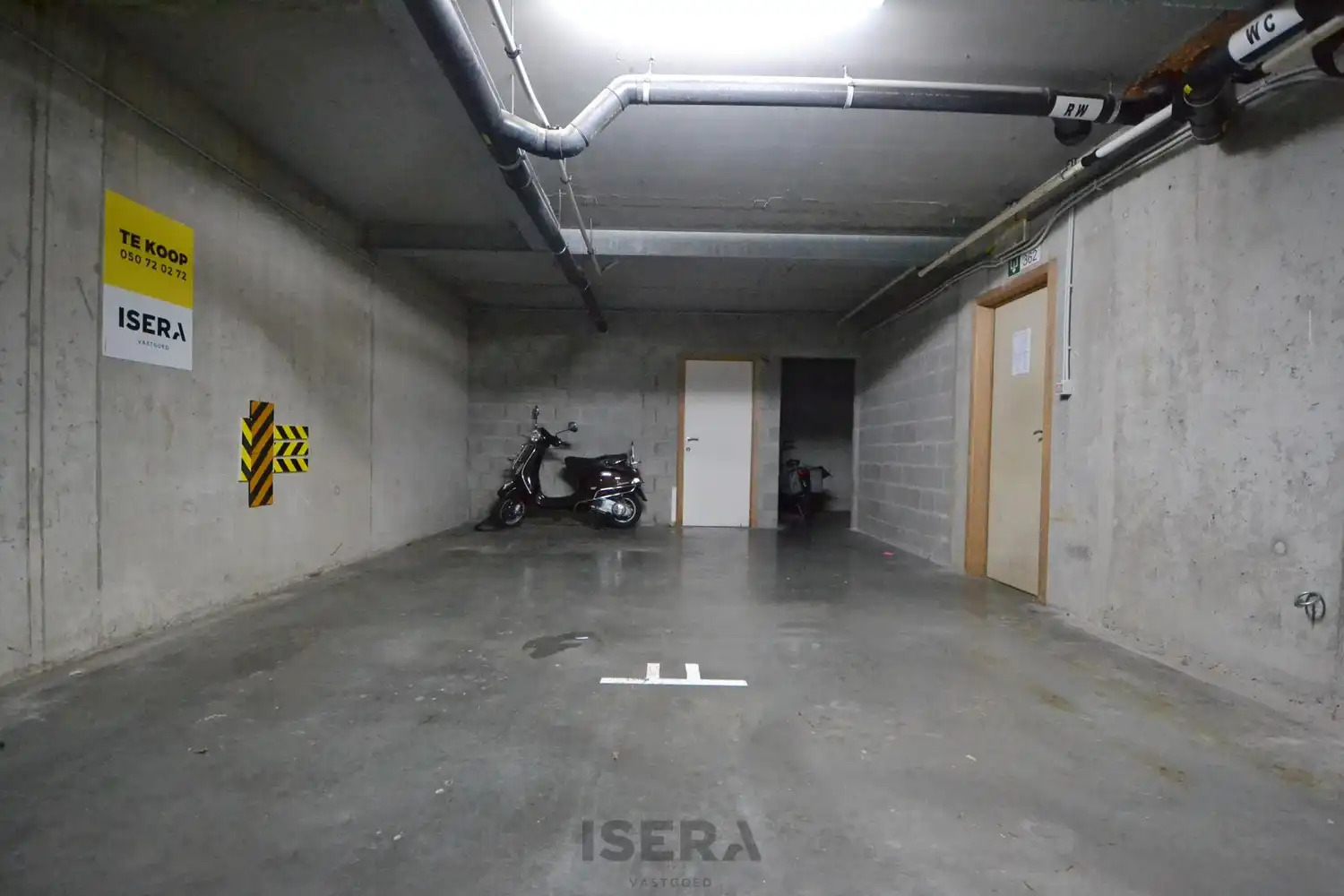 Grote ondergrondse staanplaats in hartje Sint-Andries. foto {{pictureIndex}}