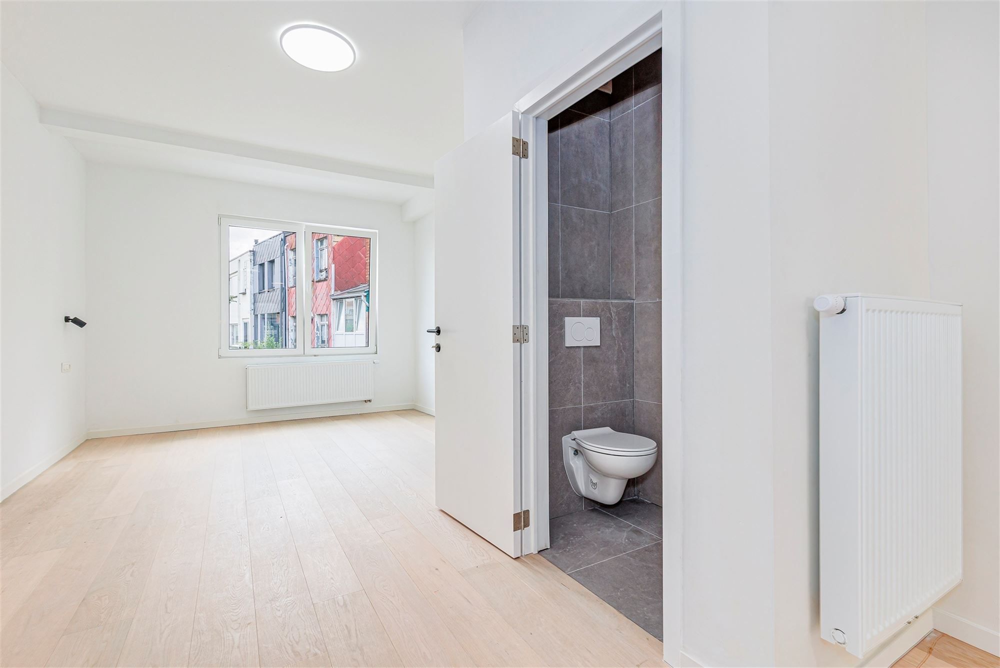 Gelijkvloers duplexappt met 3 slk + tuin foto 8