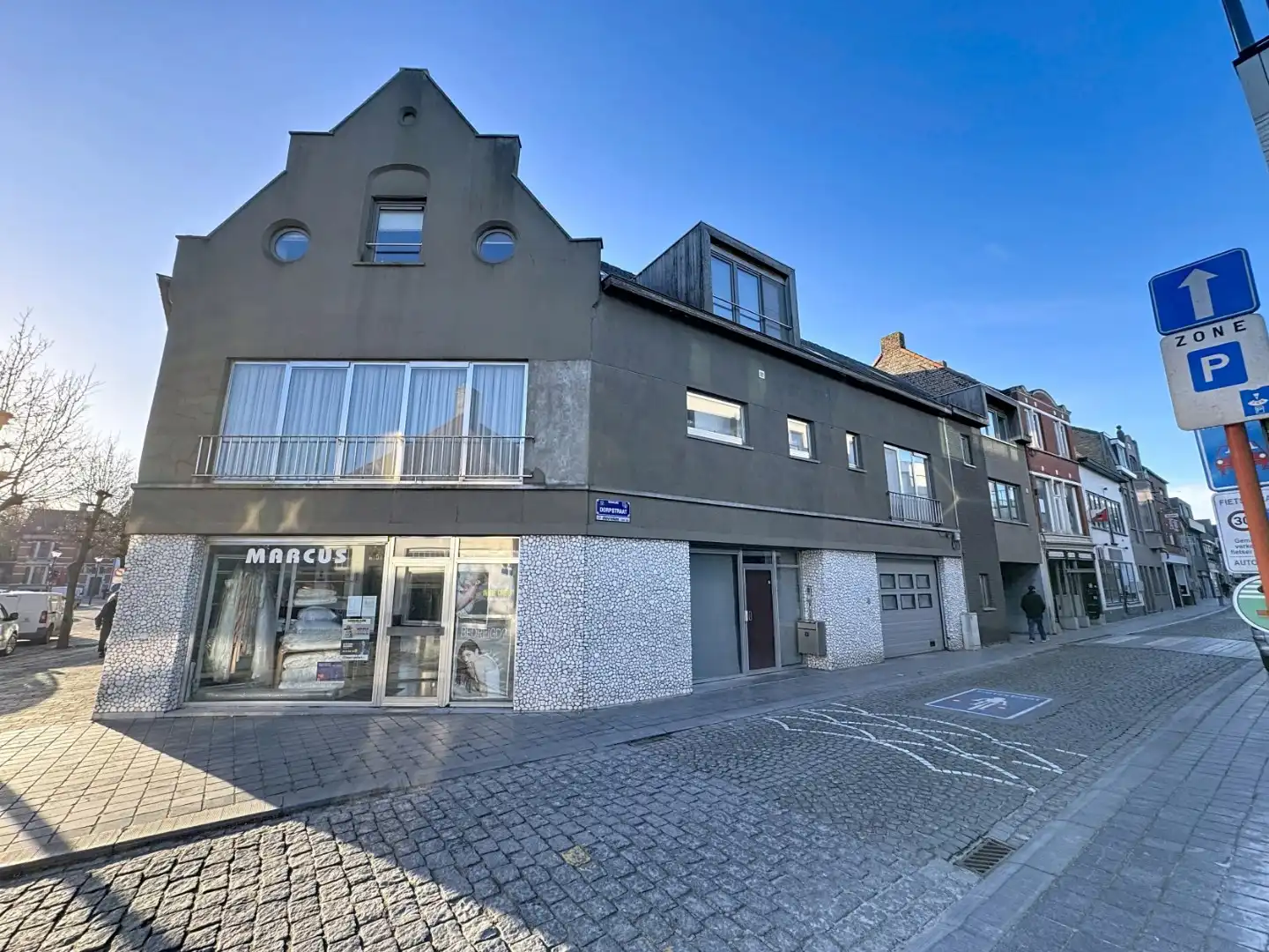 Opbrengsteigendom bestaande uit 3 appartementen + handelsgelijkvloers gelegen in het centrum foto 2