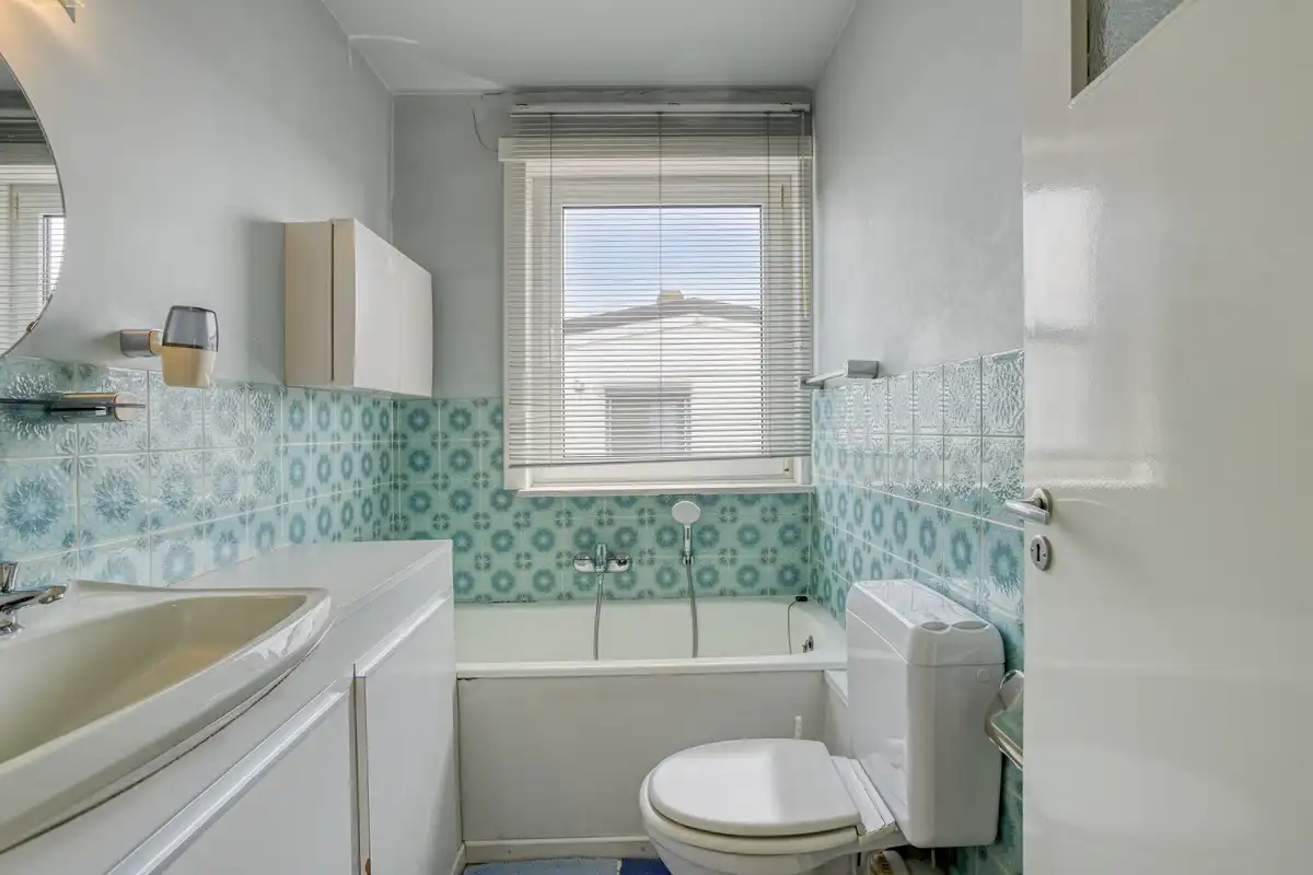 Te verfraaien woning - ruime tuin en garage foto 22