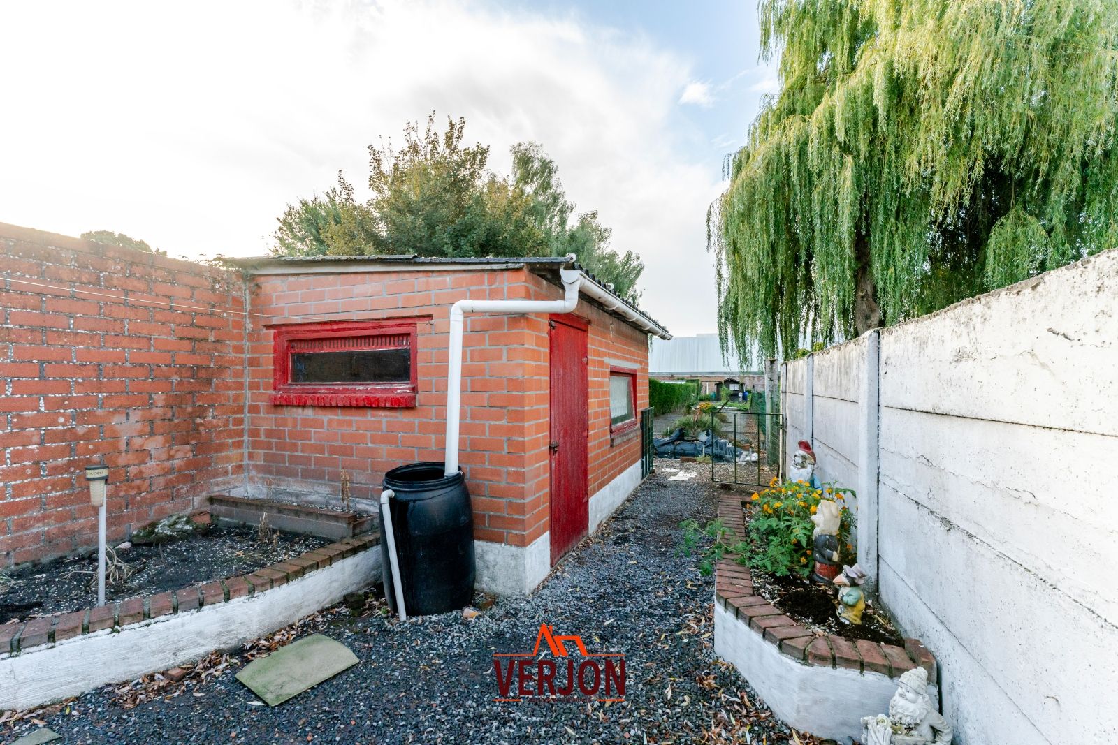 Charmante woning met ruime tuin te koop op het dorpsplein in Kachtem! foto 15