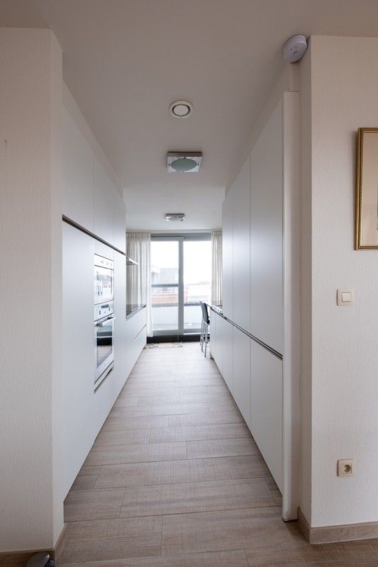 Ruim en luxueus appartement met 2,5 slaapkamers, 3 terrassen en 2 parkings in hartje Diepenbeek! foto 7