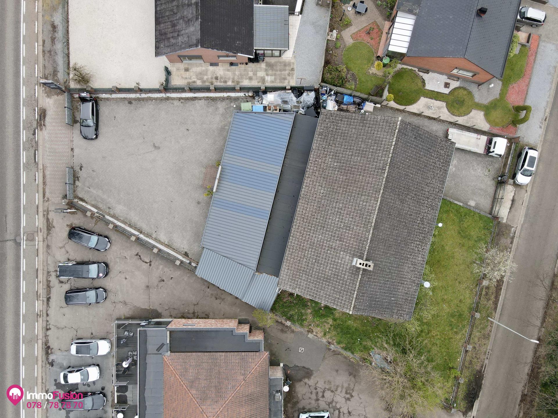 Riant handelspand met woonst en grote parking op toplocatie! foto 44