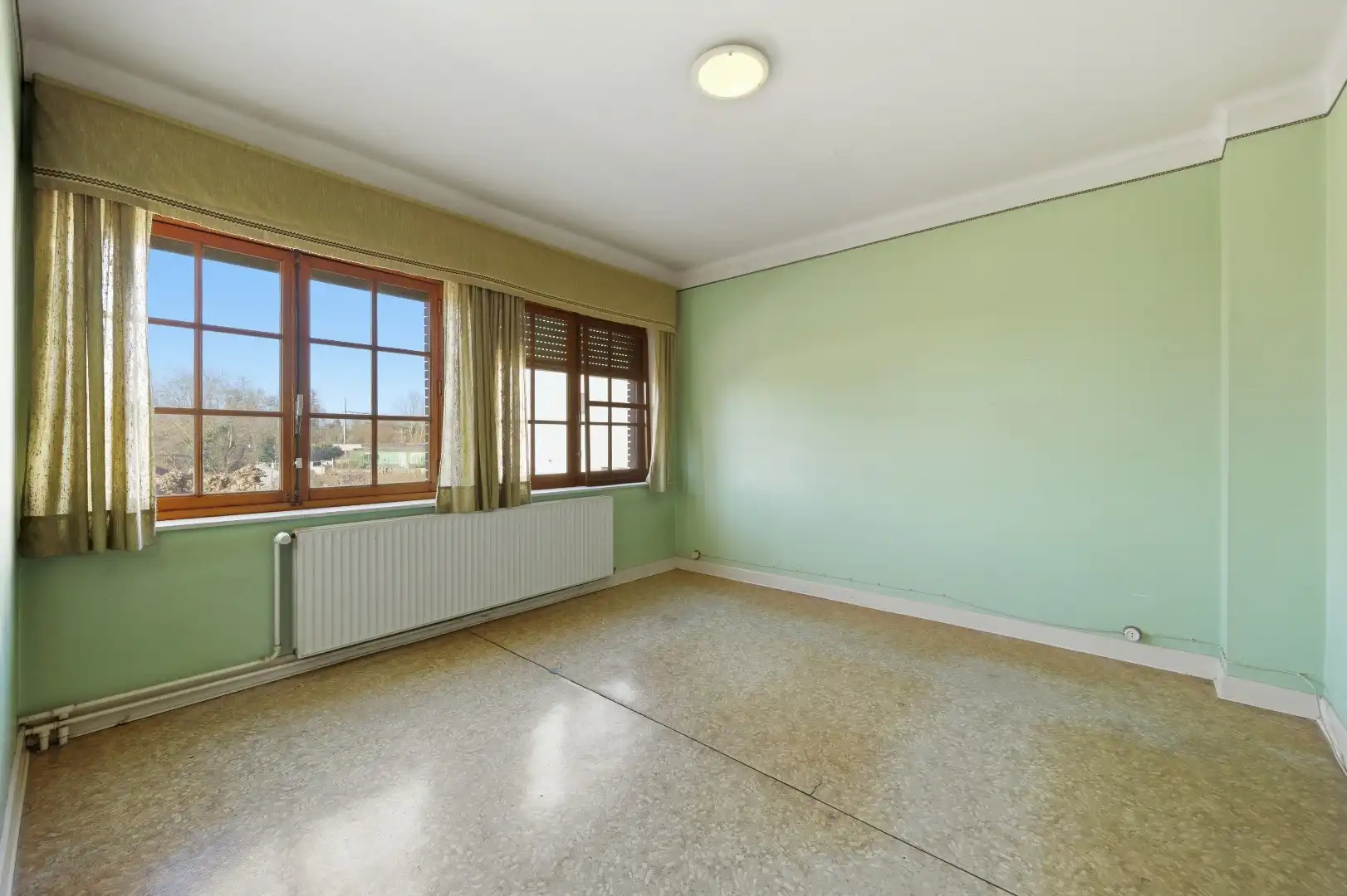 Op te frissen rijwoning met 2 slaapkamers en ruime tuin in Tienen foto 11