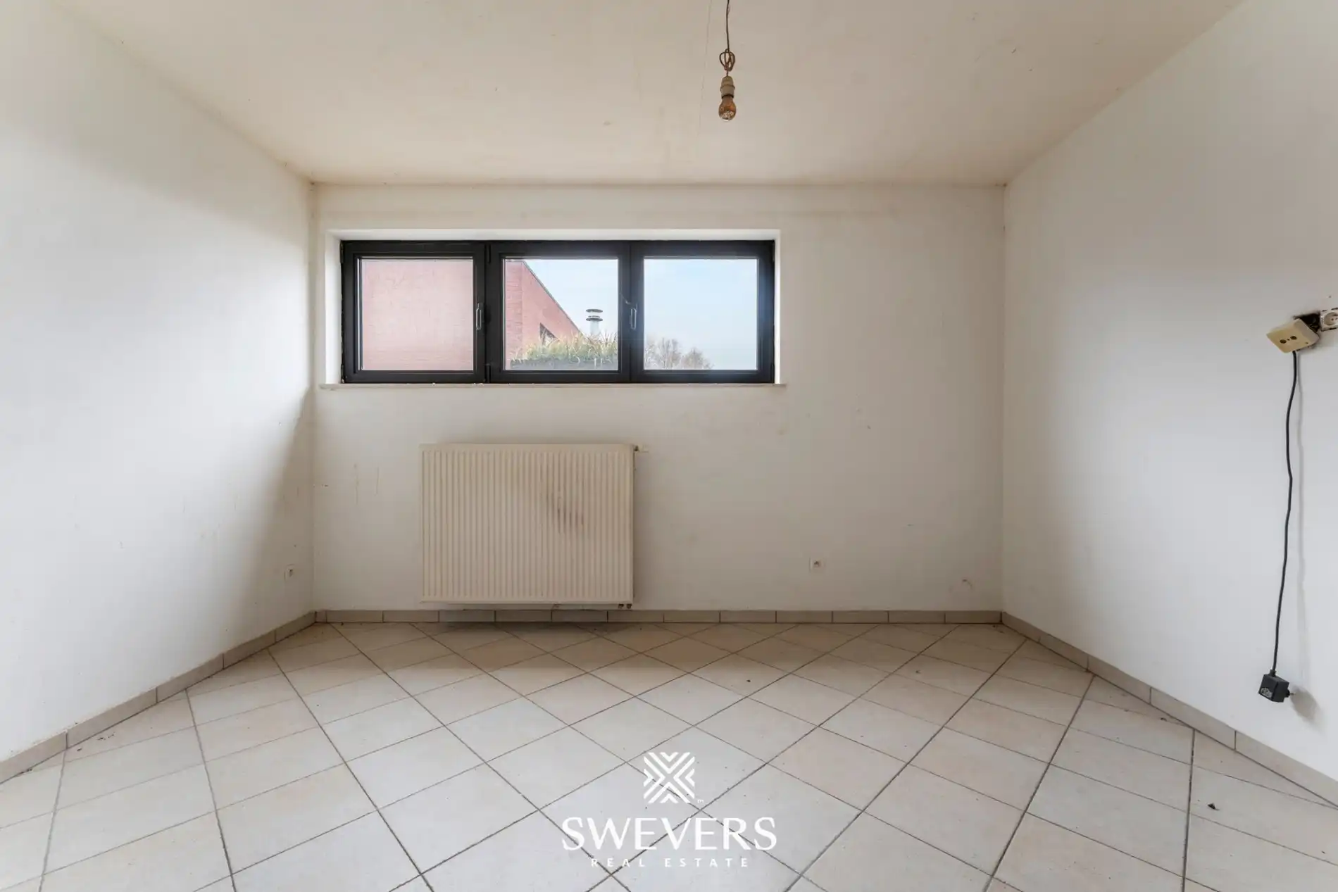 Centraal op te frissen appartement met potentieel in Halen foto 5