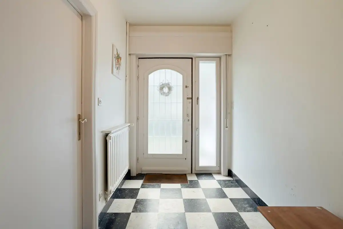 Op te frissen gelijkvloerse woning met 1 slaapkamer en garage! foto 3