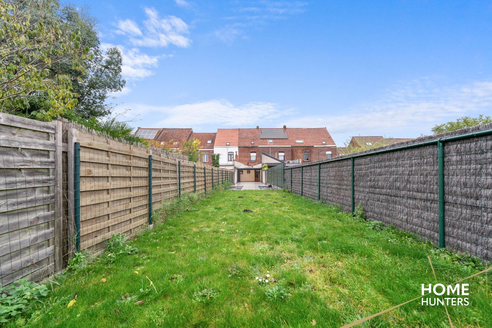 Charmante te renoveren rijwoning met 3 slaapkamers en diepe tuin op centrale ligging in Menen foto 26