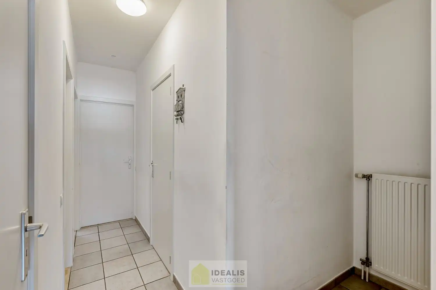 IDEALIS VASTGOED – GELIJKVLOERS APPARTEMENT MET LICHTRIJKE LEEFRUIMTE EN AANSLUITEND RUIME KEUKEN, BADKAMER, 2 SLAAPKAMERS EN GARAGEBOX OP EEN UITERST GUNSTIGE LOCATIE VLAK BIJ HET CENTRUM VAN PELT! foto 16