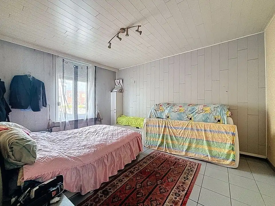 Ruime gezinswoning met diepe tuin in centrum Wuustwezel foto 12