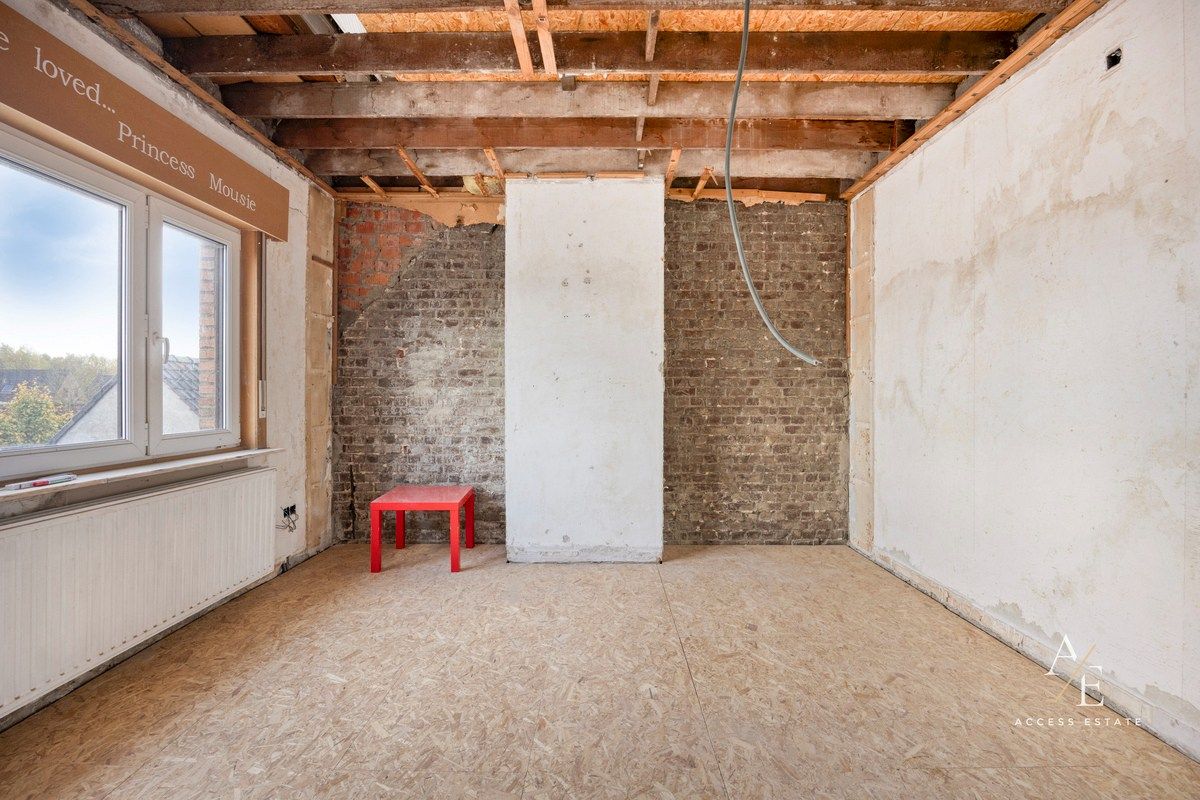 Ruime halfopen woning met potentieel in rustige straat te Melle foto 11