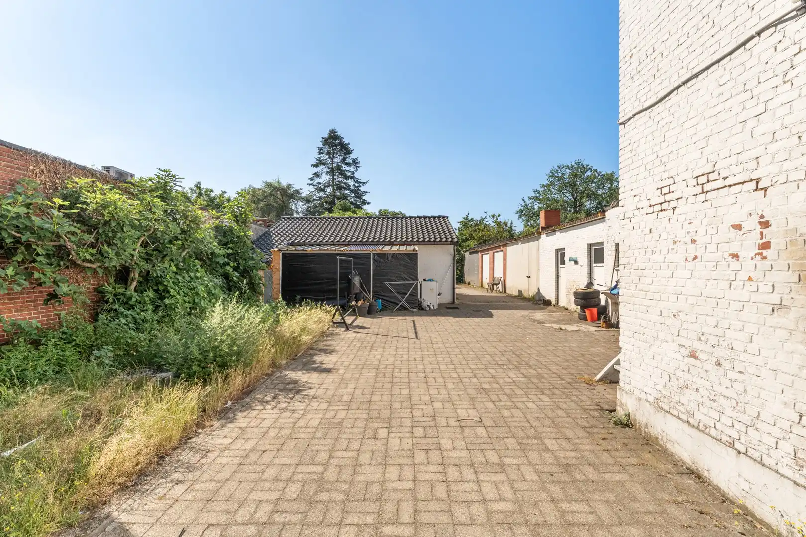 🏢 Handelspand met 2 appartementen, polyvalente ruimte en ruim perceel van 11a 19ca te koop foto 10
