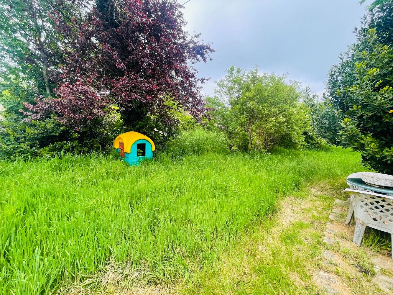 Aartrijke  Pittoreske ligging  Prachtig stuk BOUWGROND  met een oppervlakte van 1.900  m²  idyllische tuin ( ZUID-OOST) met grote diversiteit van bomen struiken en  Stilte gebied foto 5