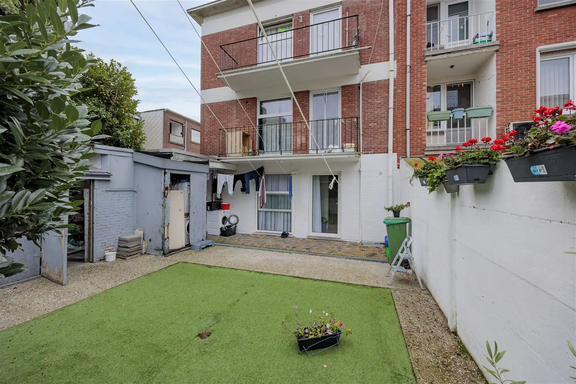 Vergund betonnen opbrengsteigendom met 3 appartementen + garagebox foto 13