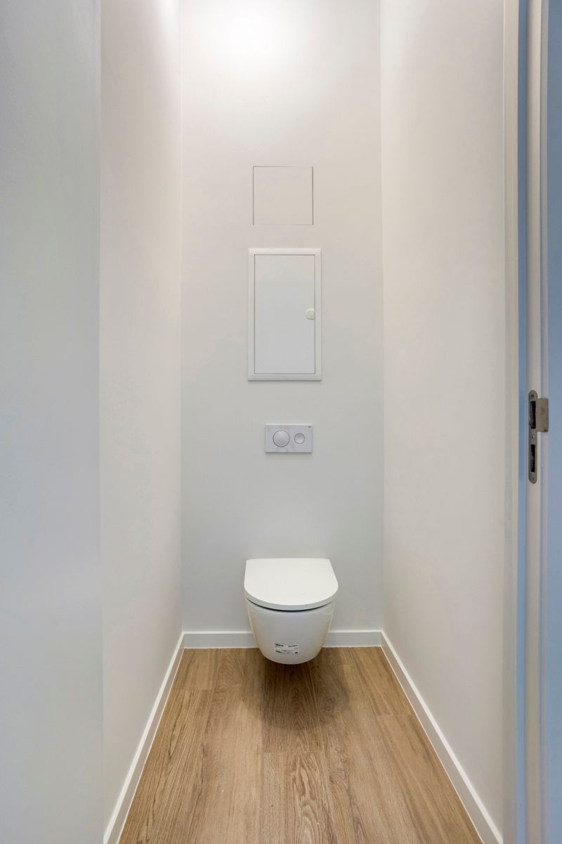 Prachtig gerenoveerd 2-slaapkamerappartement met tuin foto 11