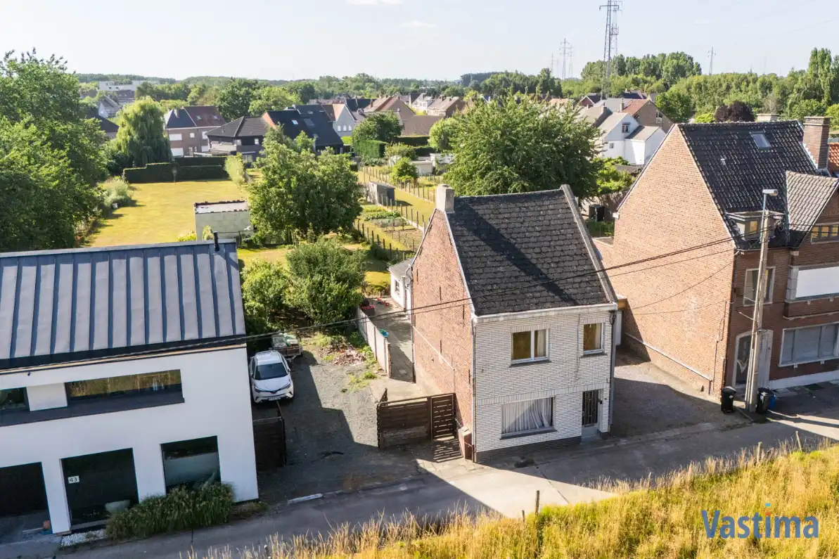 Perceel grond nabij centrum Erembodegem met zuidgerichte tuin foto {{pictureIndex}}