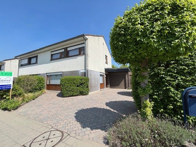 Hoofdfoto van de publicatie: Rustig gelegen, halfopen woning met 3 slpks, tuin en garage op wandelafstand van de Leie en de Zavelput.