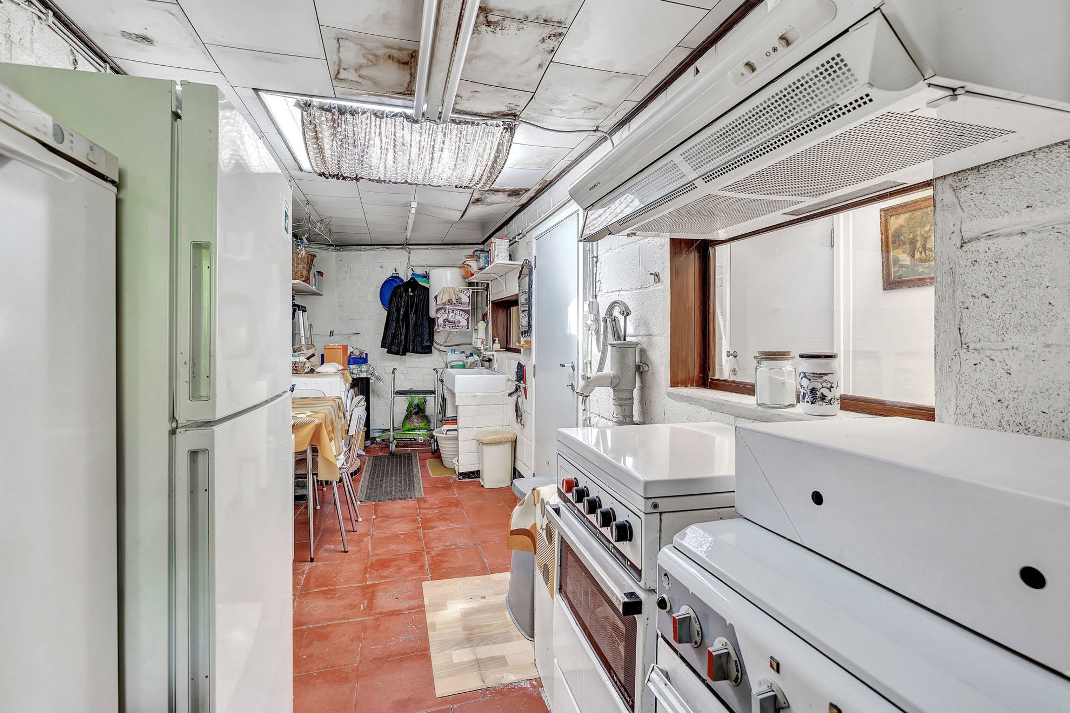 Te renoveren woning met tuin en perceel met garage foto 13