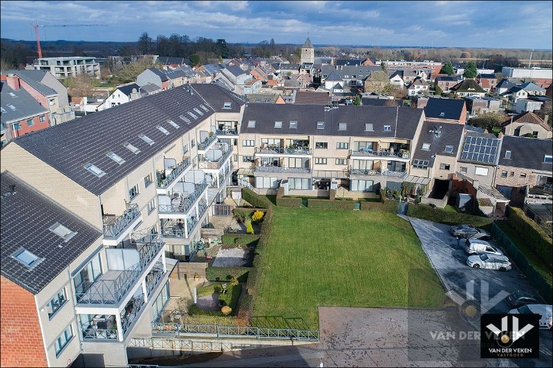 Zeer ruim, lichtrijk en instapklaar gelijkvloers appartement met tuin en gedeeltelijk overdekt terras in het centrum van Kortessem foto 15