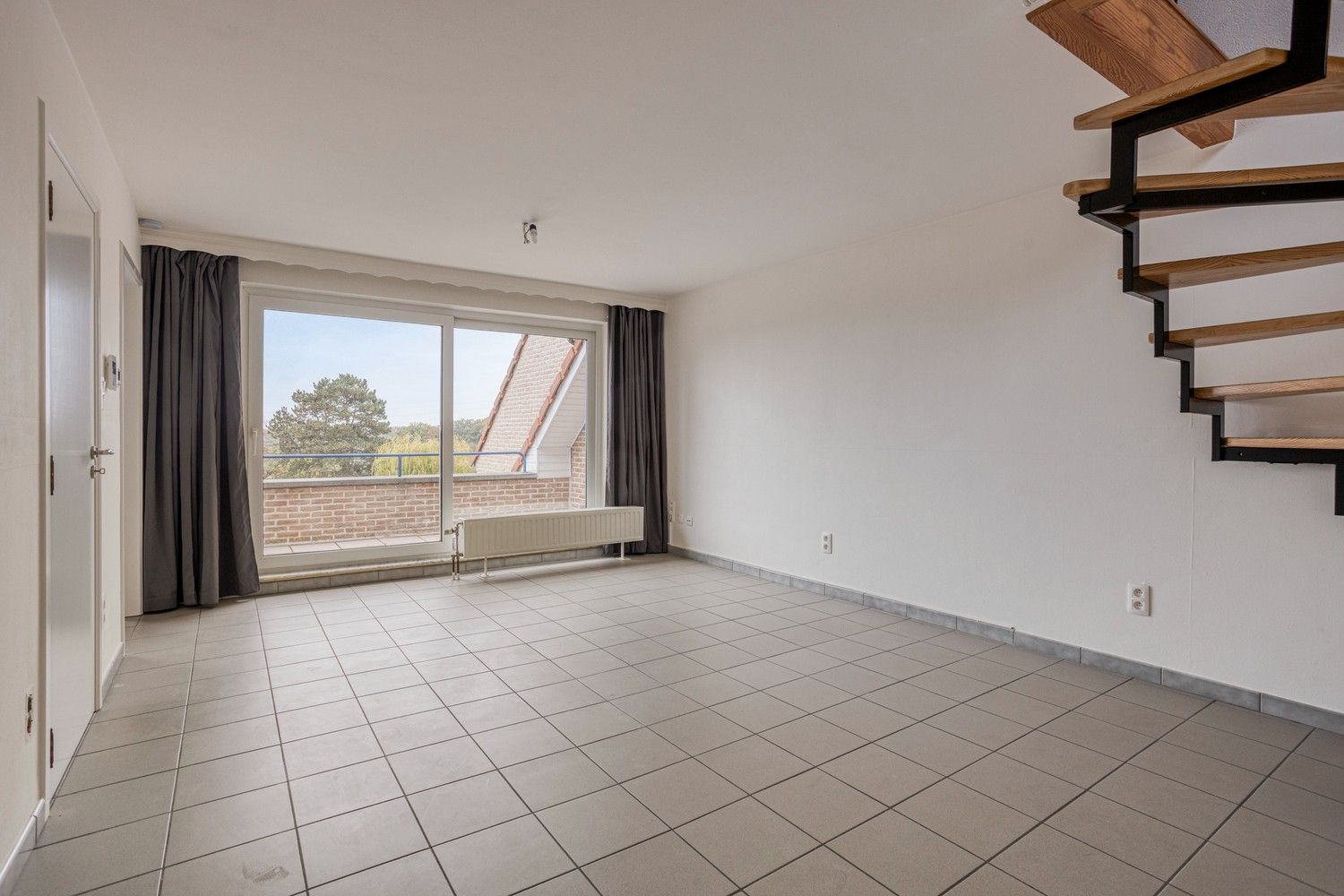 Ruim duplex-appartement met 3 slaapkamers in het hart van Gellik foto 6