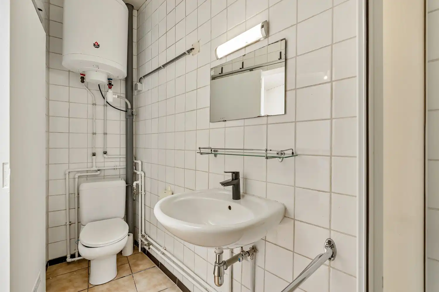 Goed gelegen rijwoning met 2 slaapkamers en een af te werken zolderruimte te Leuven! foto 9