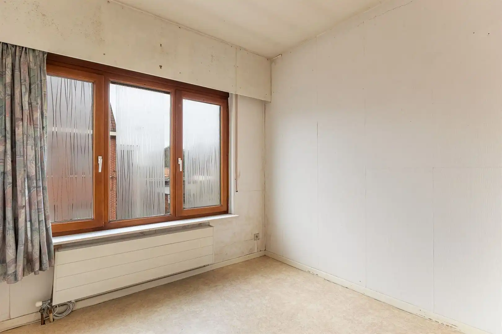 Te renoveren gezinswoning met tuin en garage in rustige centrumstraat foto 15