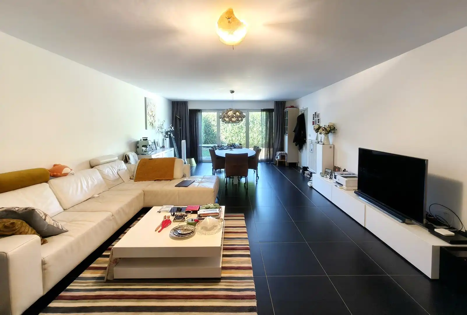 RUIM GELIJKVLOERS APPARTEMENT MET TUIN EN GARAGE foto 2