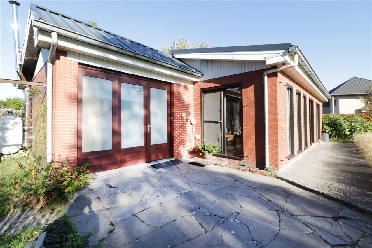 Rustig gelegen woning met 2 slpk, riante tuin en garage foto 2