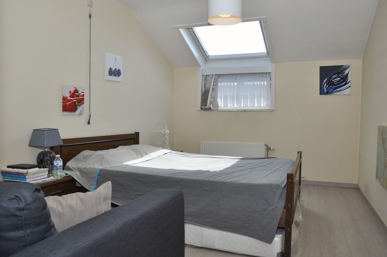 Ruim en licht duplex app met 4 slk, groot terras en garagebox foto 10