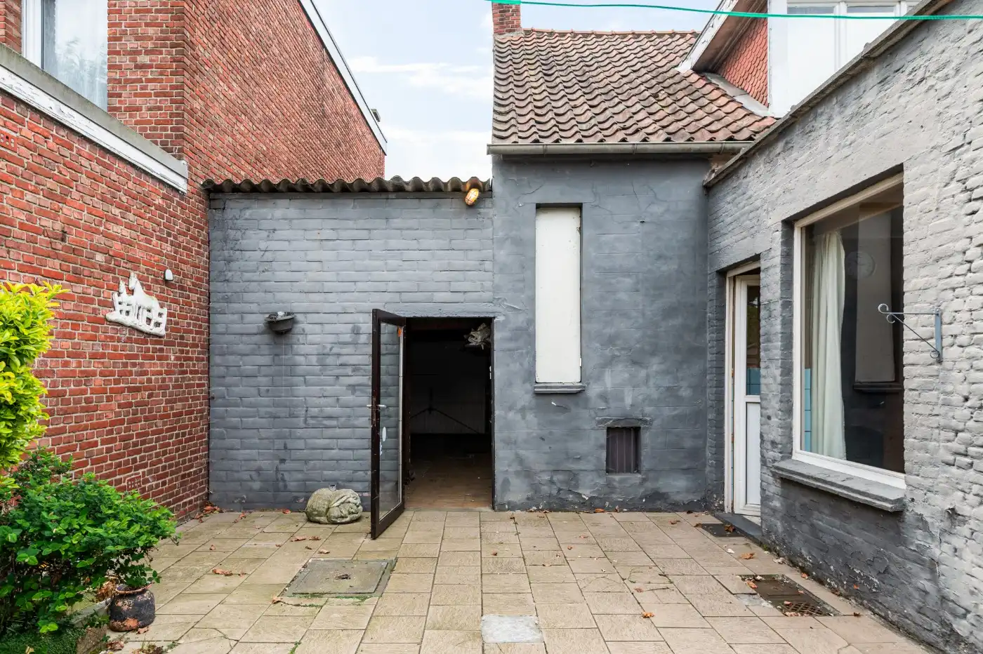 Te renoveren woning met 3 slpk., stadstuin en garage foto 23