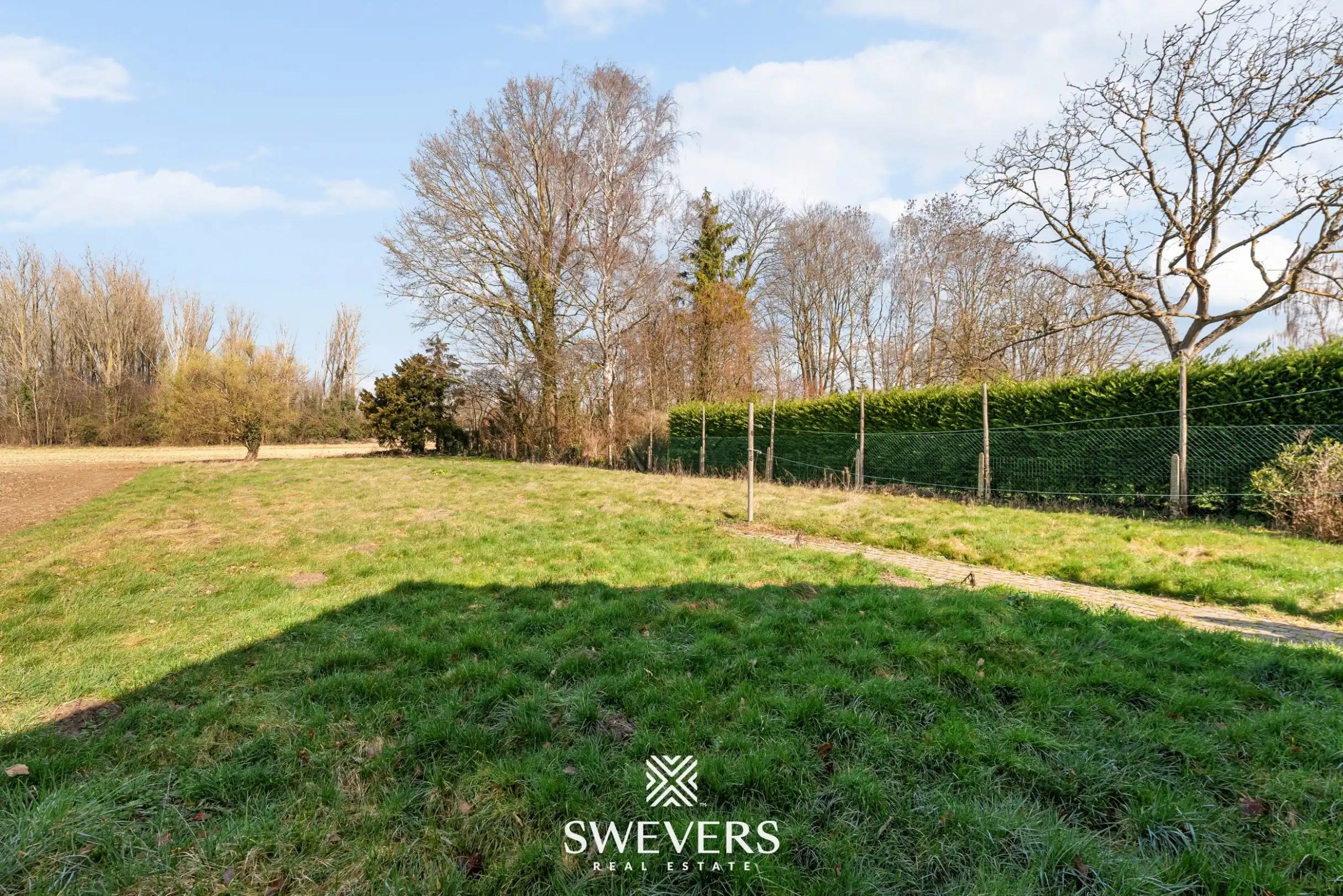 Te renoveren woning met 4 slaapkamers, grote tuin en omliggende velden op rustige ligging nabij centrum Diepenbeek foto 36