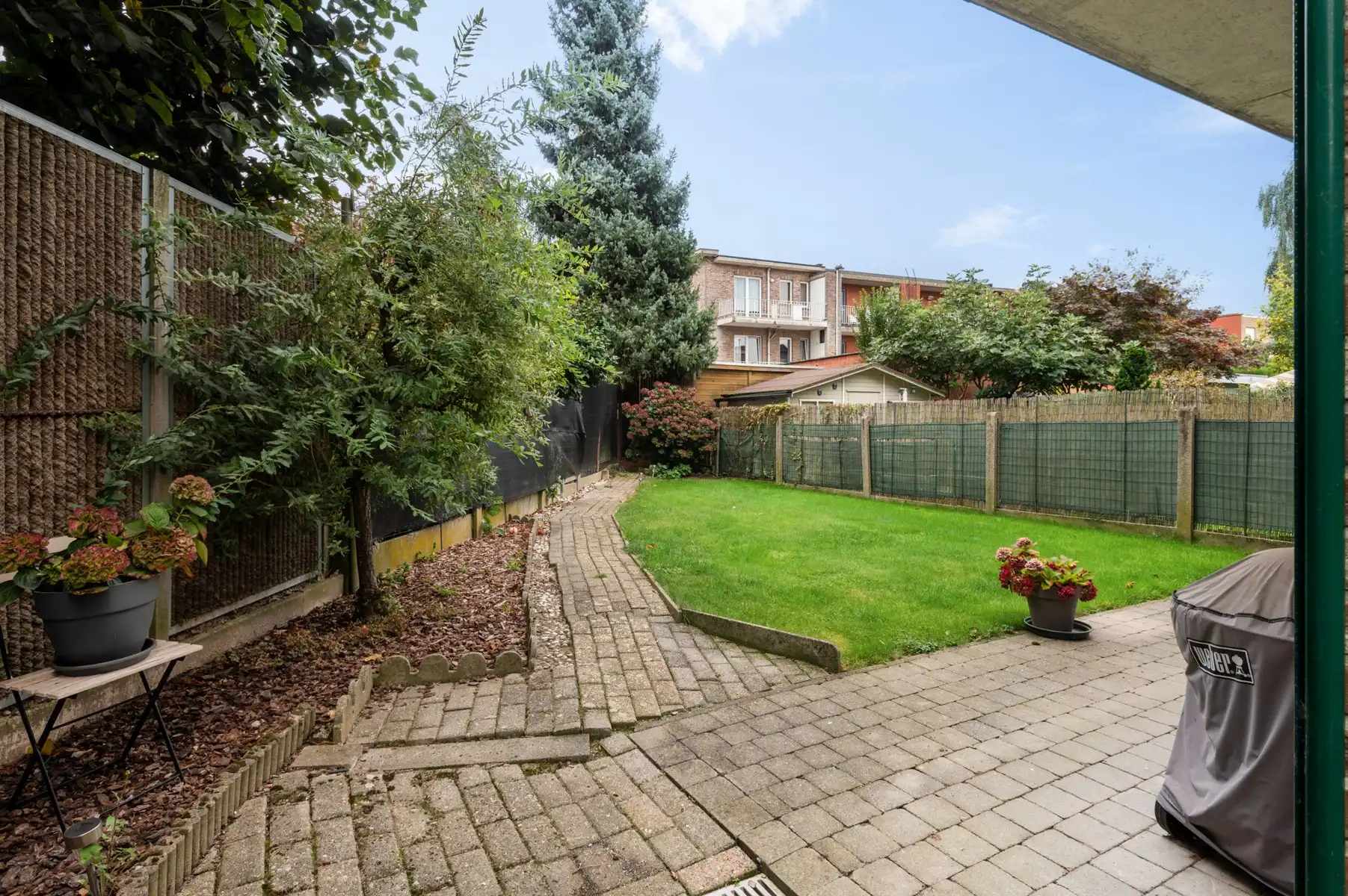 Gelijkvloersappartement met zonnige tuin, garage en staanplaats foto 4